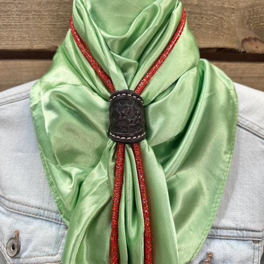 a green scarf with a black buckle on it