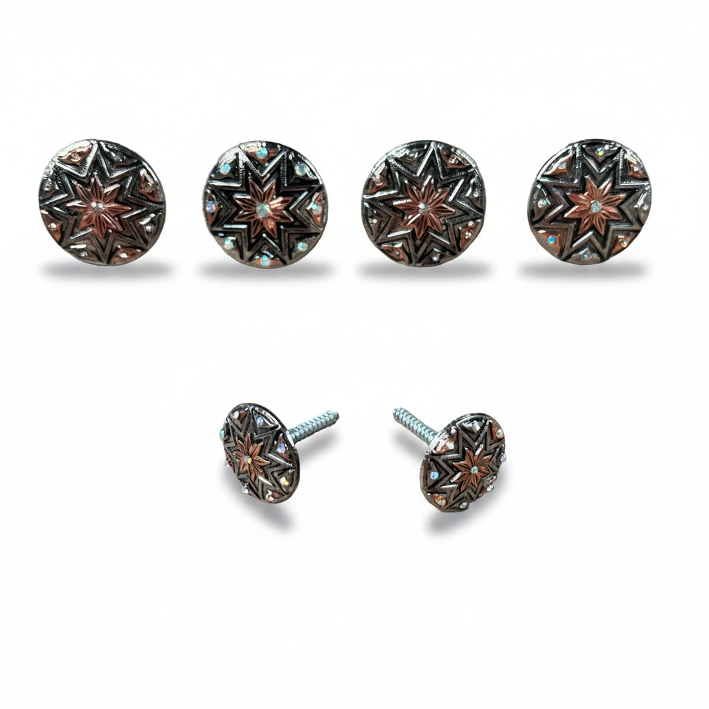 a collection of six round metal buttons with star-shaped designs, arranged in two rows of three.