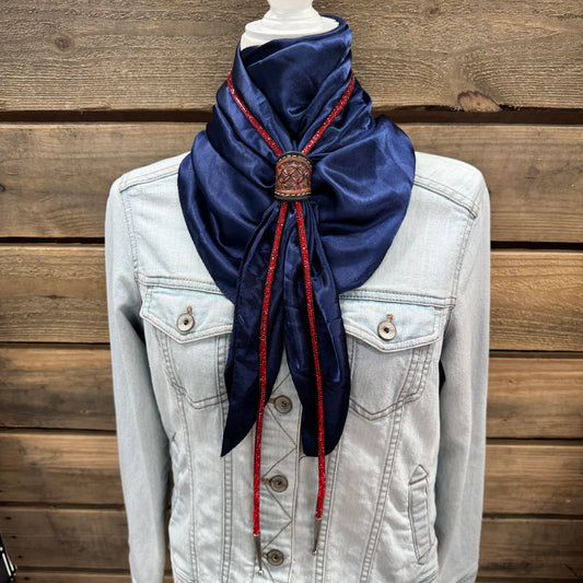 a white jacket and a blue scarf on a mannequin