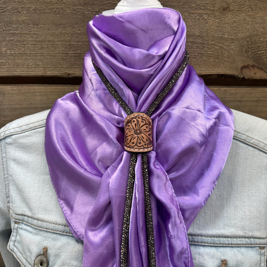 a purple scarf with a wooden button on it