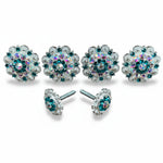 a collection of ornate, sparkling jewelry pieces, including earrings and buttons, with a variety of colors and designs.