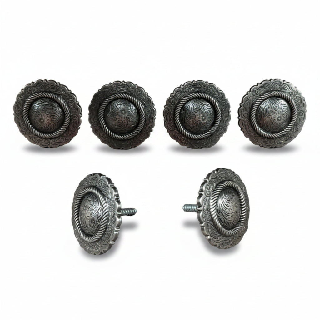 six silver-colored metal knobs or buttons arranged in two rows of three, with two of them being identical.