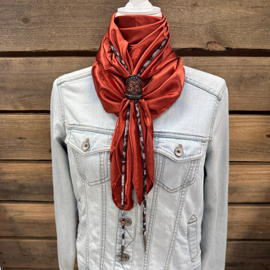 a white jacket and a red scarf on a mannequin