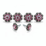 a pair of ornate earrings with pink gemstones and intricate designs, including floral patterns and metallic elements.