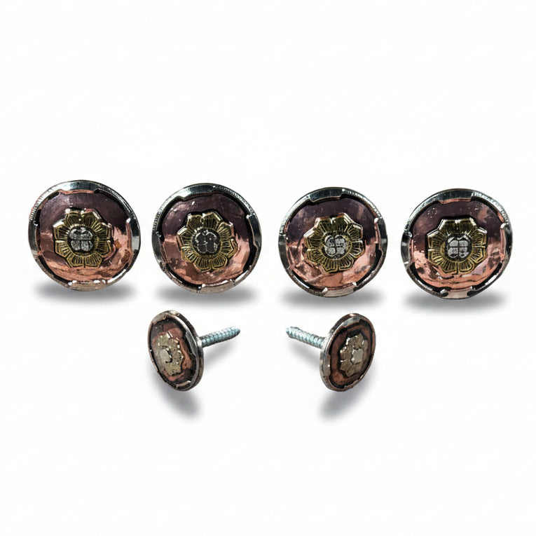 a collection of five round metal knobs with intricate designs, arranged in a row on a white background.