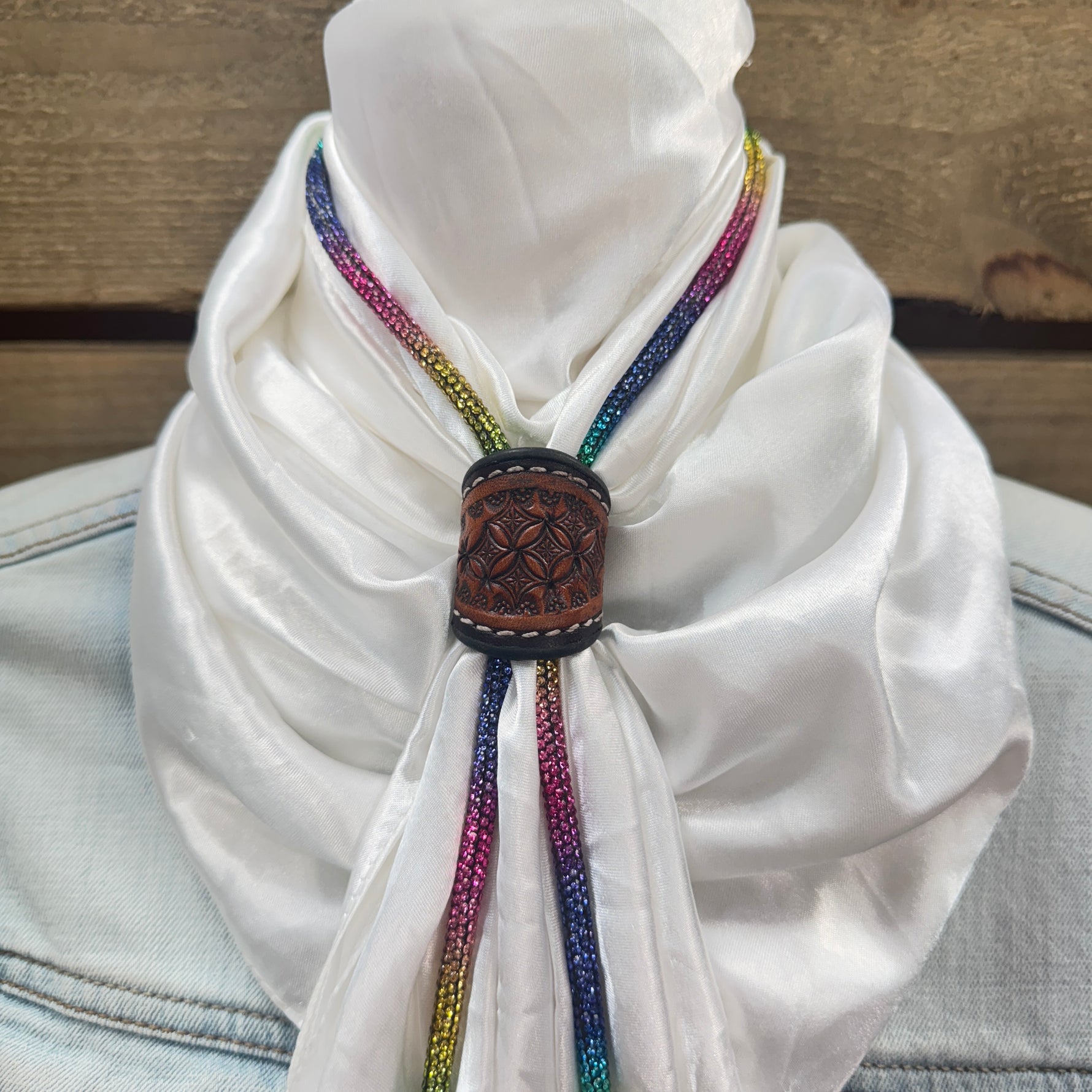 a close up of a white scarf on a mannequin