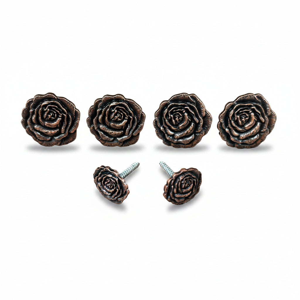a collection of six ornate, bronze-colored rose-shaped knobs or handles, each with a screw on the back, arranged in a row.