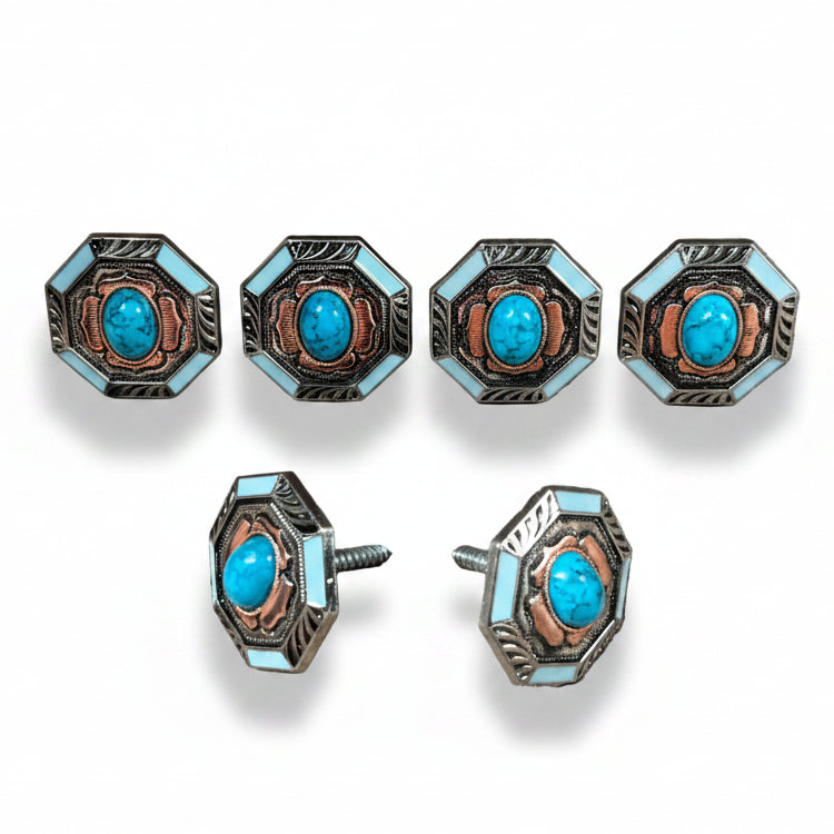 a collection of ornate, turquoise-colored knobs or buttons with intricate designs, arranged in two rows.