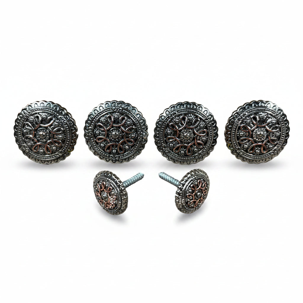 a collection of ornate, circular knobs or handles with intricate designs, arranged in a row.