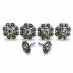 a collection of ornate, decorative jewelry pieces, including earrings and buttons, adorned with sparkling gemstones and intricate metalwork.