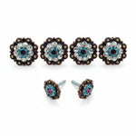 a collection of ornate, decorative knobs and earrings with intricate designs and sparkling gemstones.