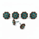a collection of ornate, turquoise-colored buttons with intricate designs, including a group of four buttons and two additional buttons.