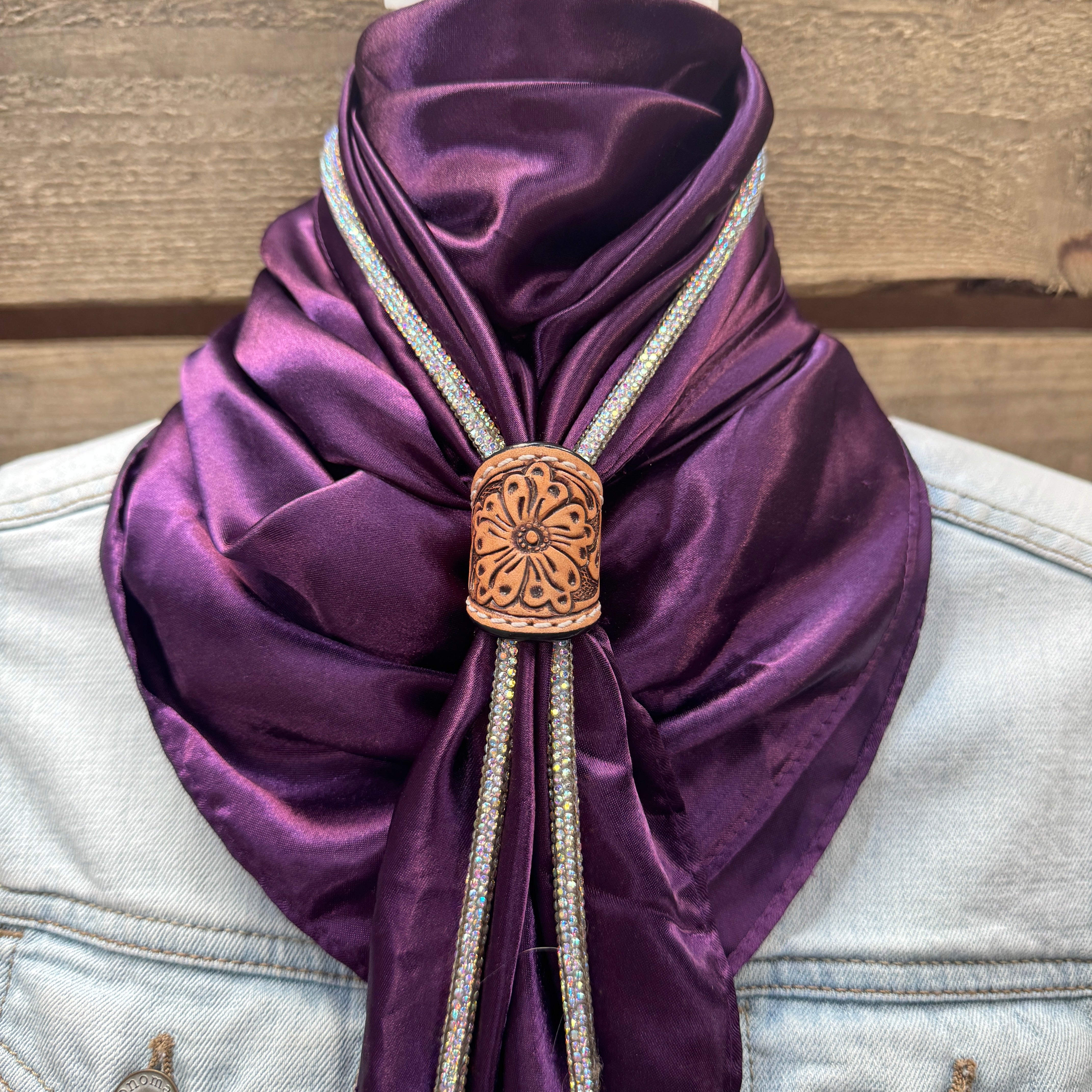 a close up of a purple scarf on a jacket