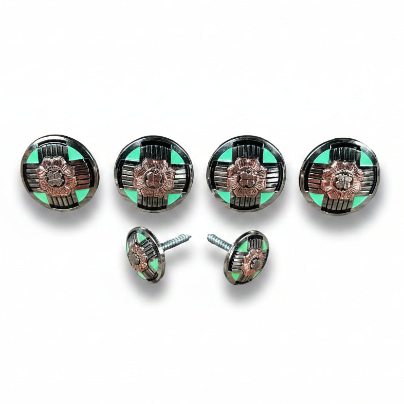 a collection of six round, metallic buttons with a floral design, arranged in two rows of three.