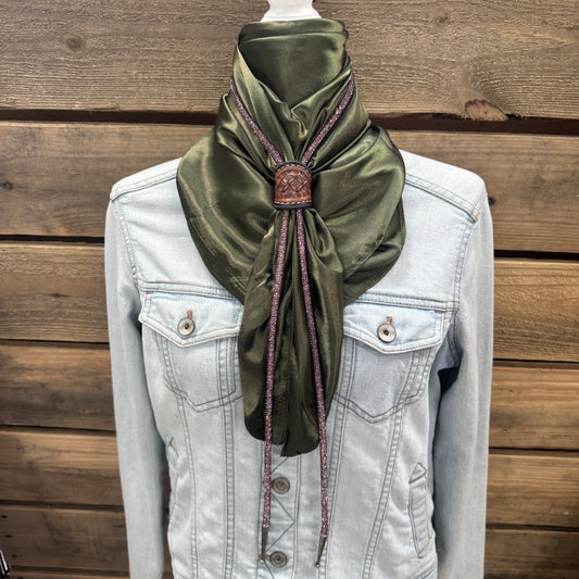 a white jacket and a green scarf on a mannequin