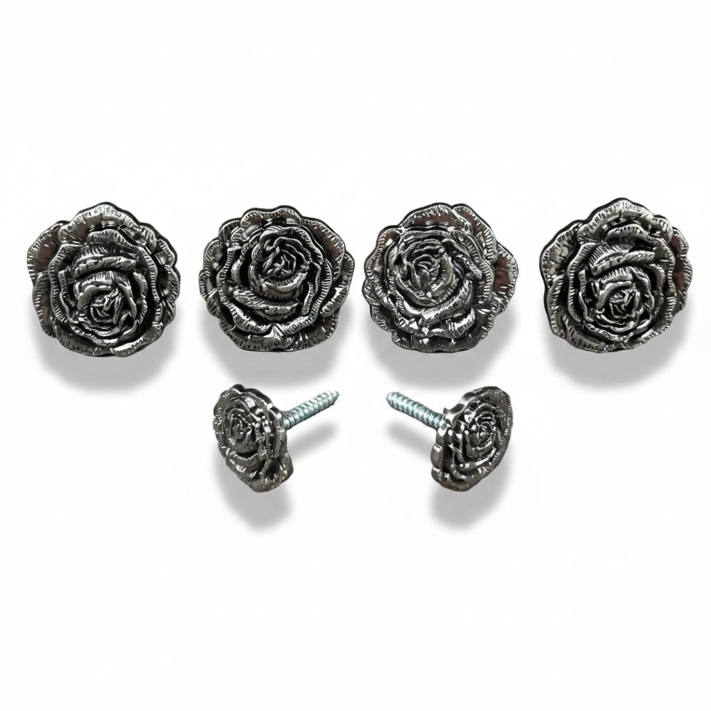 a collection of five ornate metal rose-shaped knobs or handles, each with a unique design and size.