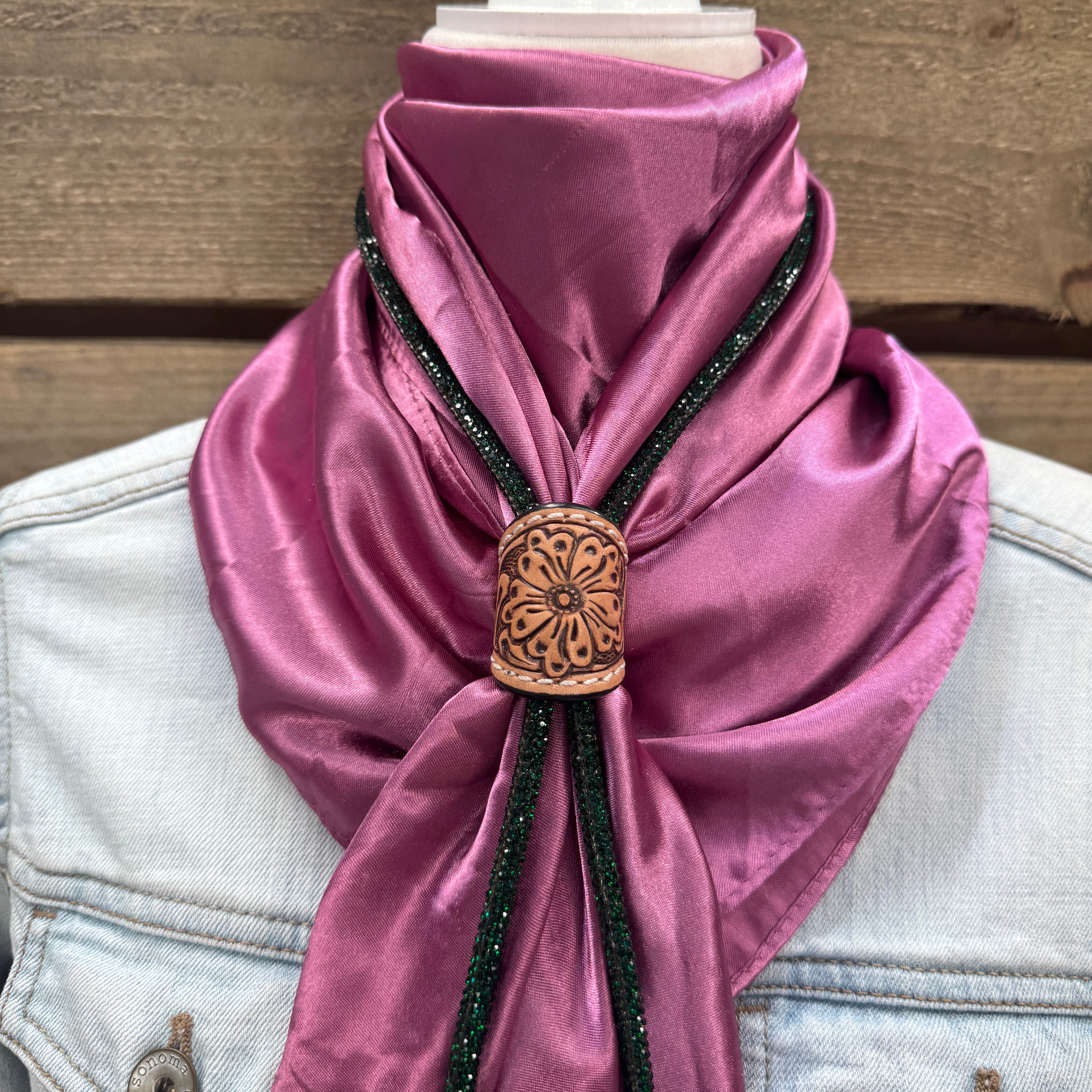 a purple scarf with a wooden button on it