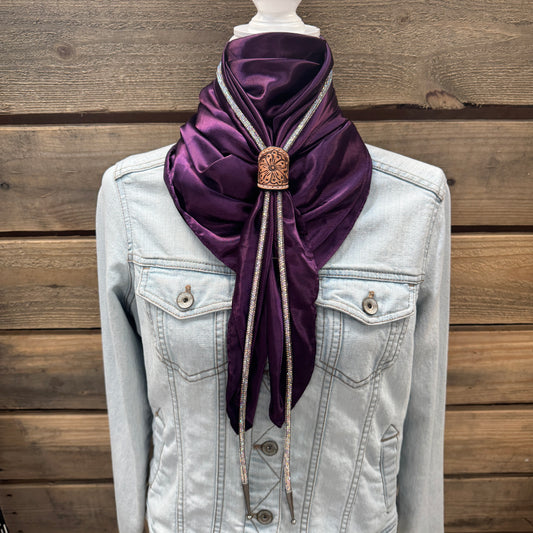 a white jacket with a purple scarf on top of it