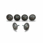 a collection of six silver-colored metal buttons with star-shaped designs, arranged in two rows of three.