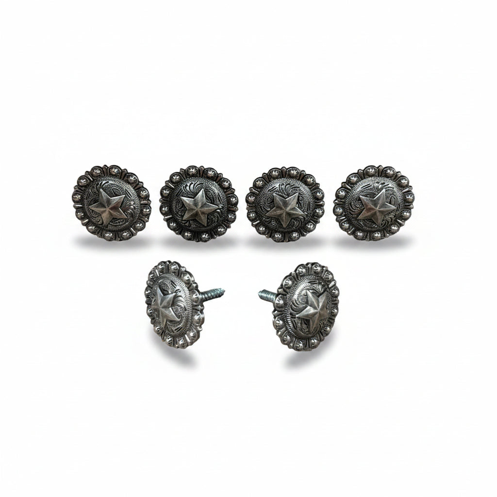 a collection of six silver-colored metal buttons with star-shaped designs, arranged in two rows of three.