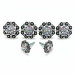 a collection of ornate, sparkling jewelry pieces, including earrings and a ring, all adorned with numerous gemstones.