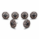 six ornate, circular knobs with intricate designs and black gemstones or stones embedded in them.