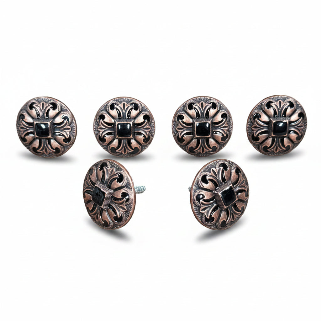 six ornate, circular knobs with intricate designs and black gemstones or stones embedded in them.