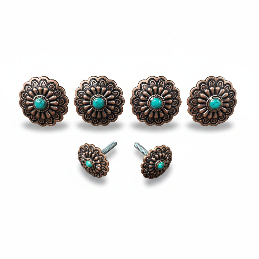 a collection of ornate, decorative metal pieces with turquoise stones, including knobs and handles, arranged in a row.