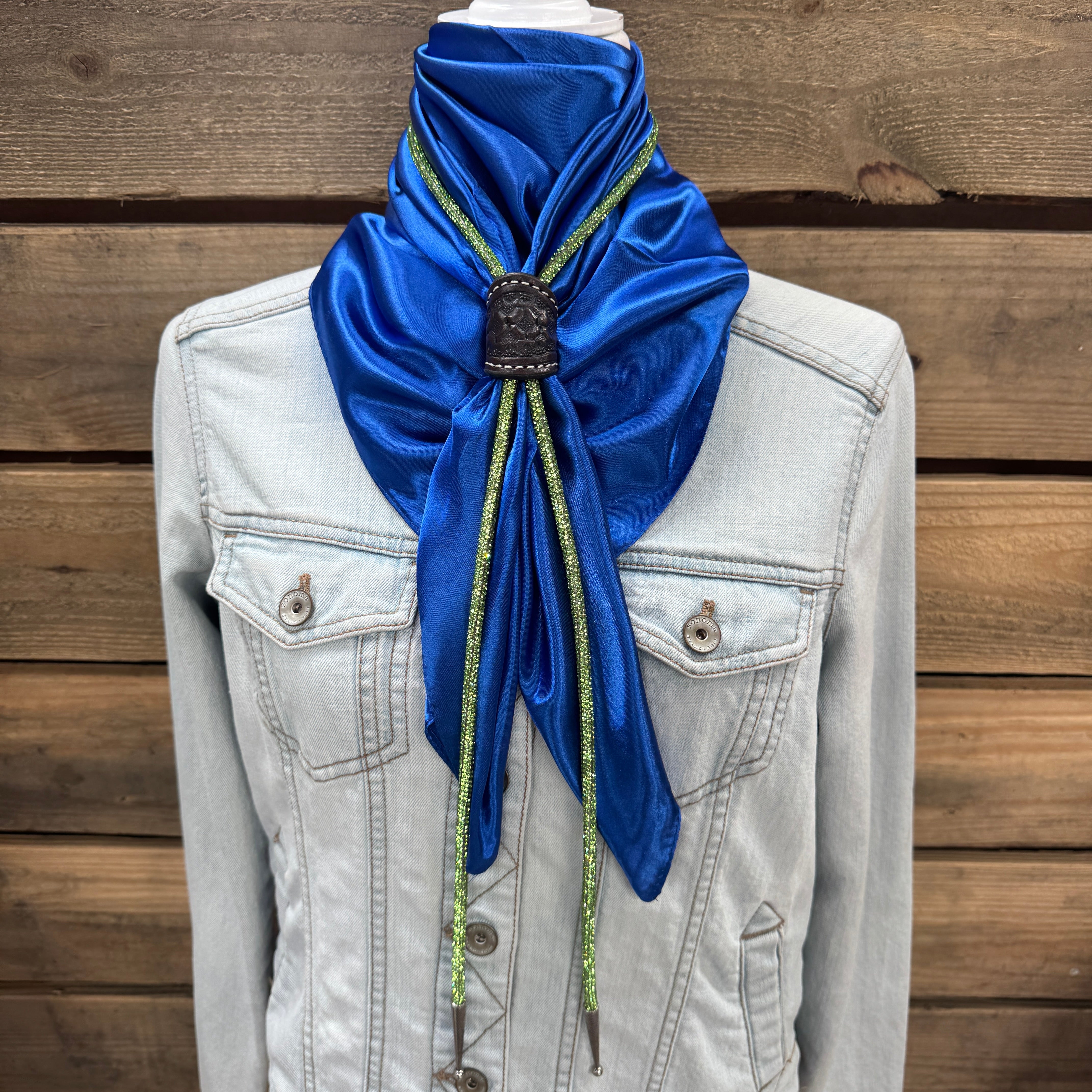 a white jacket with a blue scarf on top of it