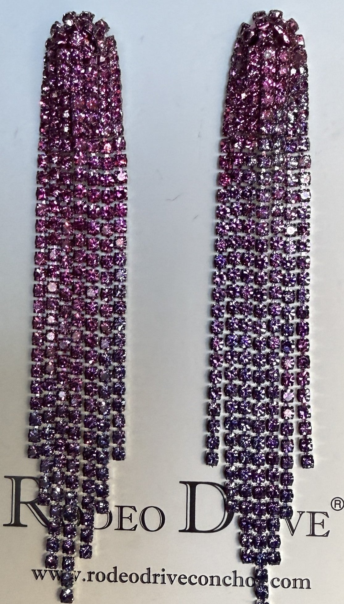 Long, dangling earrings with pink gemstones