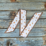 Pink and tan floral Western_Wild_Rag_Scarf_for_Cowgirls_Rodeo_Drive_Conchos