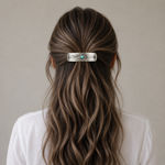 Person with wavy hair wearing a decorative hair clip on a neutral background | Rodeo Drive Conchos | 