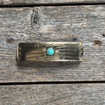 gold hair clip with a turquoise stone on a neutral background | rodeo drive conchos |