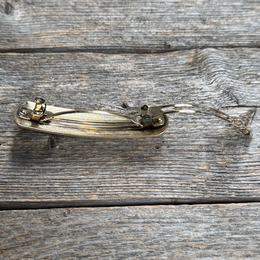  gold hair clip  accessory back with a turquoise stone on a neutral background | rodeo drive conchos |