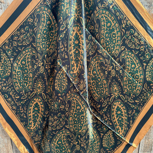 Patterned fabric with paisley design on a wooden surface