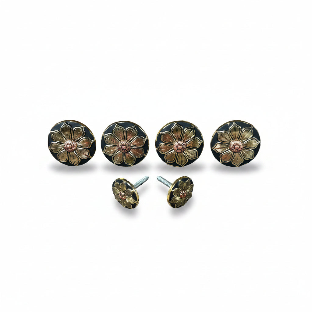 a set of five ornate black and gold knobs with flower-like designs, arranged in a row.