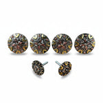 a collection of ornate, circular knobs or door handles with intricate designs and metallic elements.