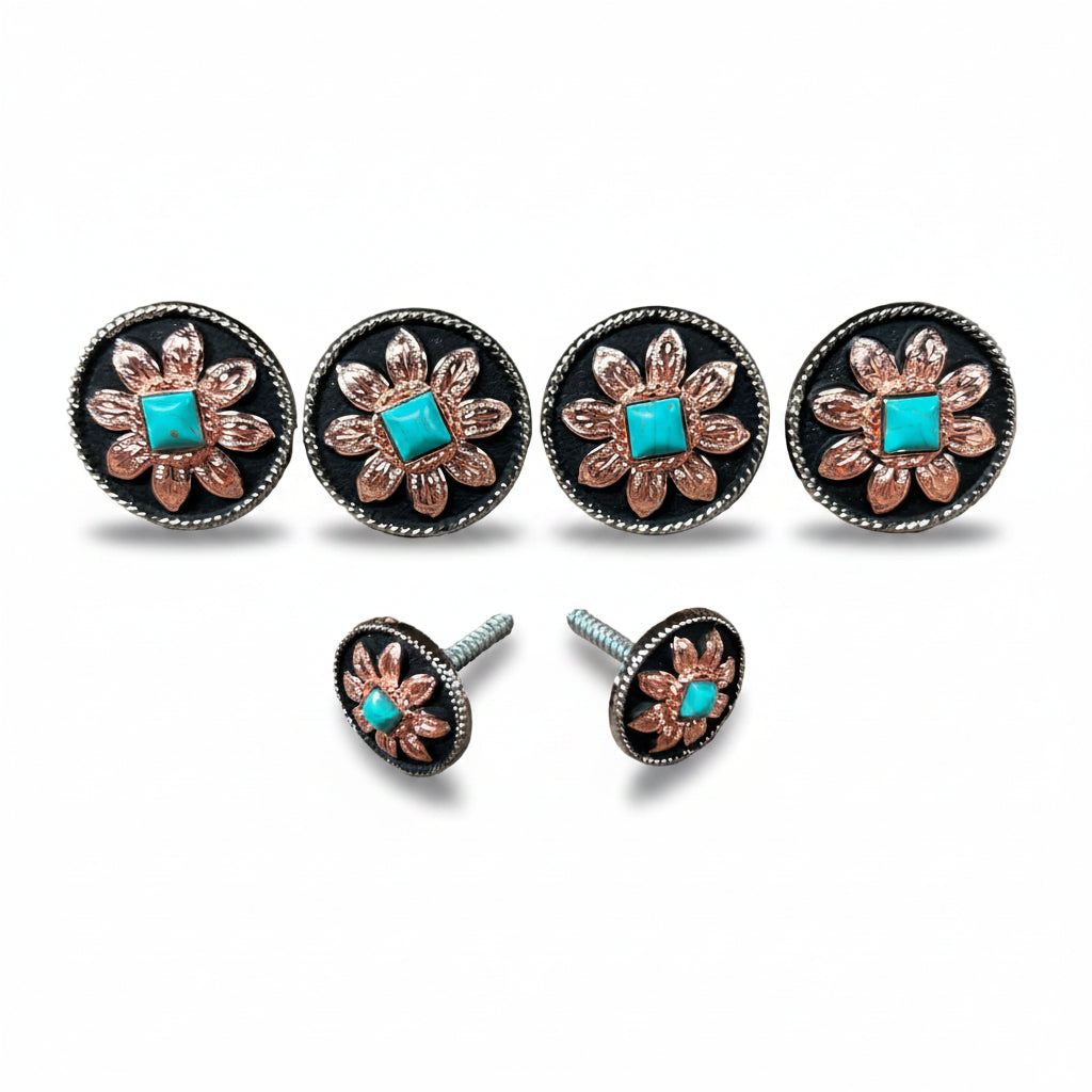 a collection of ornate metal buttons with turquoise stones, arranged in a row.