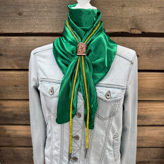a green scarf tied to a jacket on a mannequin