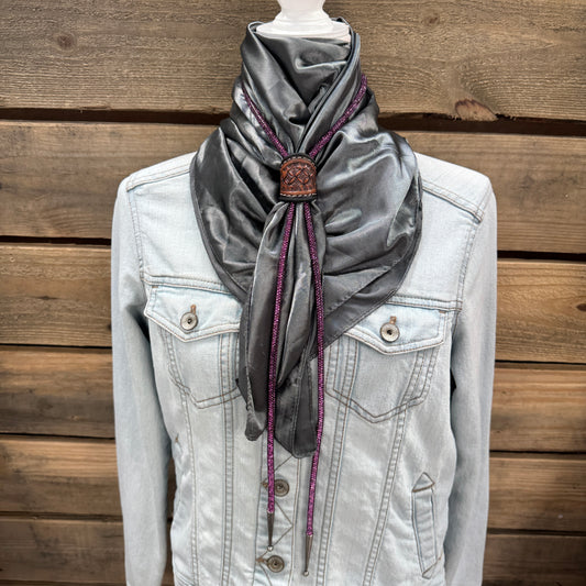 a white jacket and a gray scarf on a mannequin