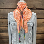 a jacket and a scarf on a mannequin