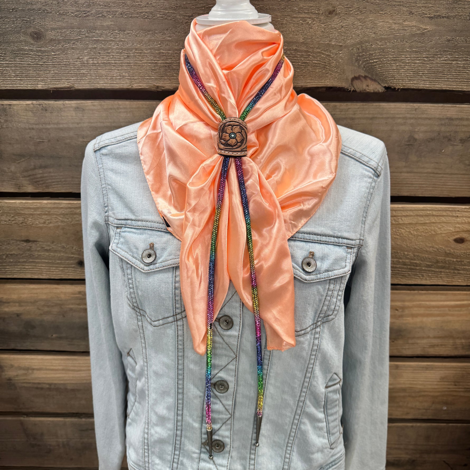 a jacket and a scarf on a mannequin