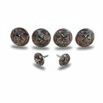 a collection of six metal buttons with star designs, arranged in two rows of three.
