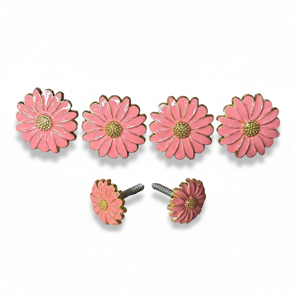 a collection of pink flower-shaped knobs or handles, each adorned with a gold center and a silver screw. The knobs are arranged in a row, with two of them placed next to each other.