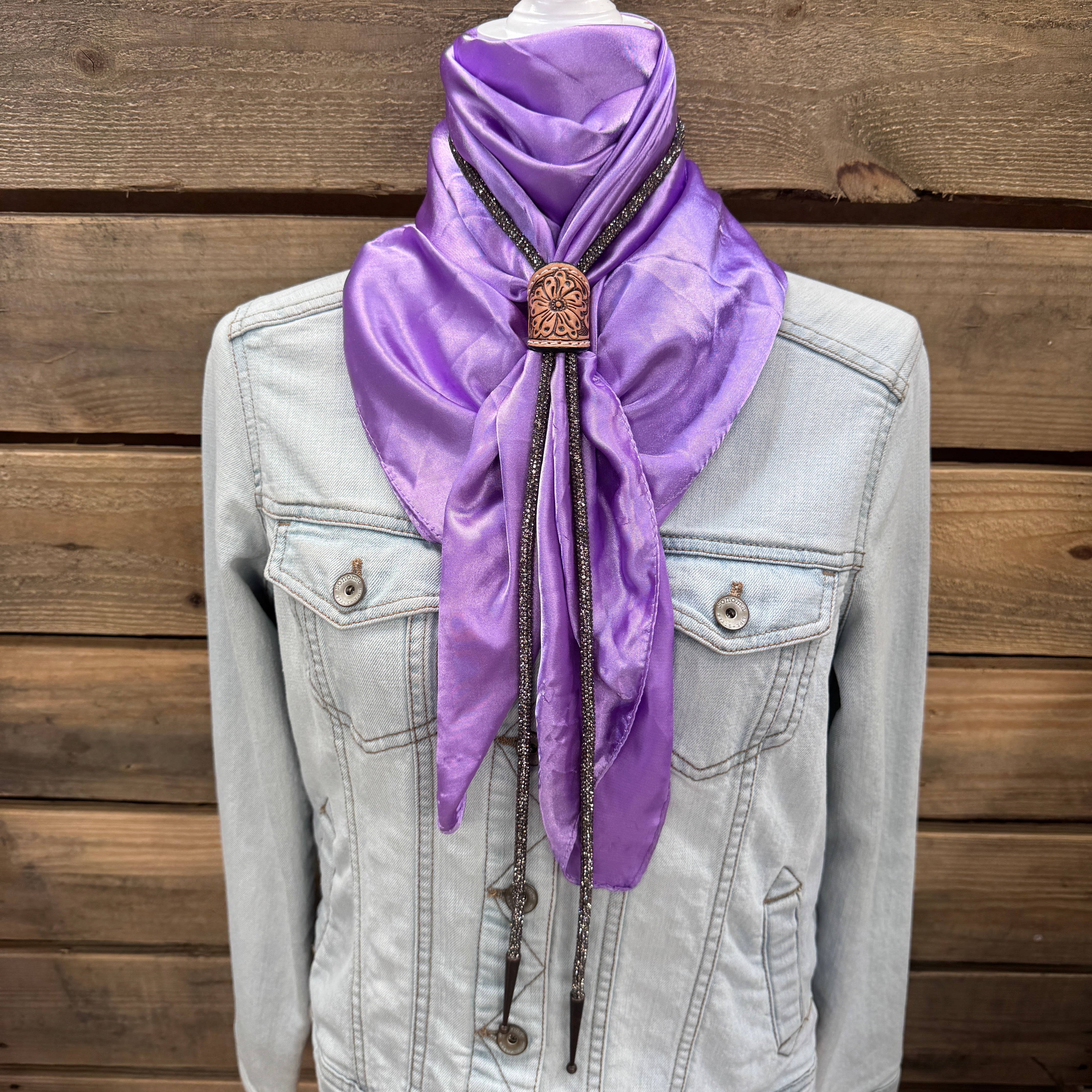 a purple scarf is hanging on a jacket