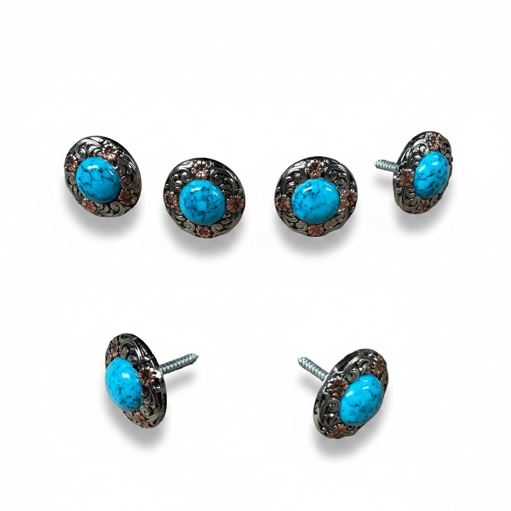 a collection of turquoise-colored metal buttons with floral designs, arranged in a grid-like pattern.