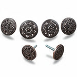 a collection of ornate, circular knobs or handles with intricate designs, including floral patterns and geometric shapes.