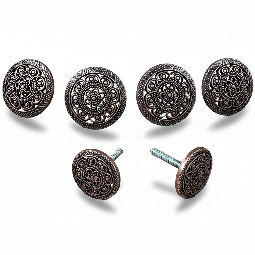 a collection of ornate, circular knobs or handles with intricate designs, including floral patterns and geometric shapes.