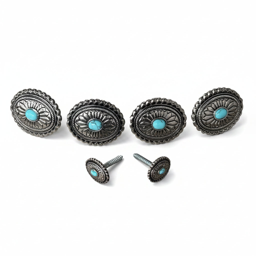 a collection of ornate silver knobs and handles adorned with turquoise stones.