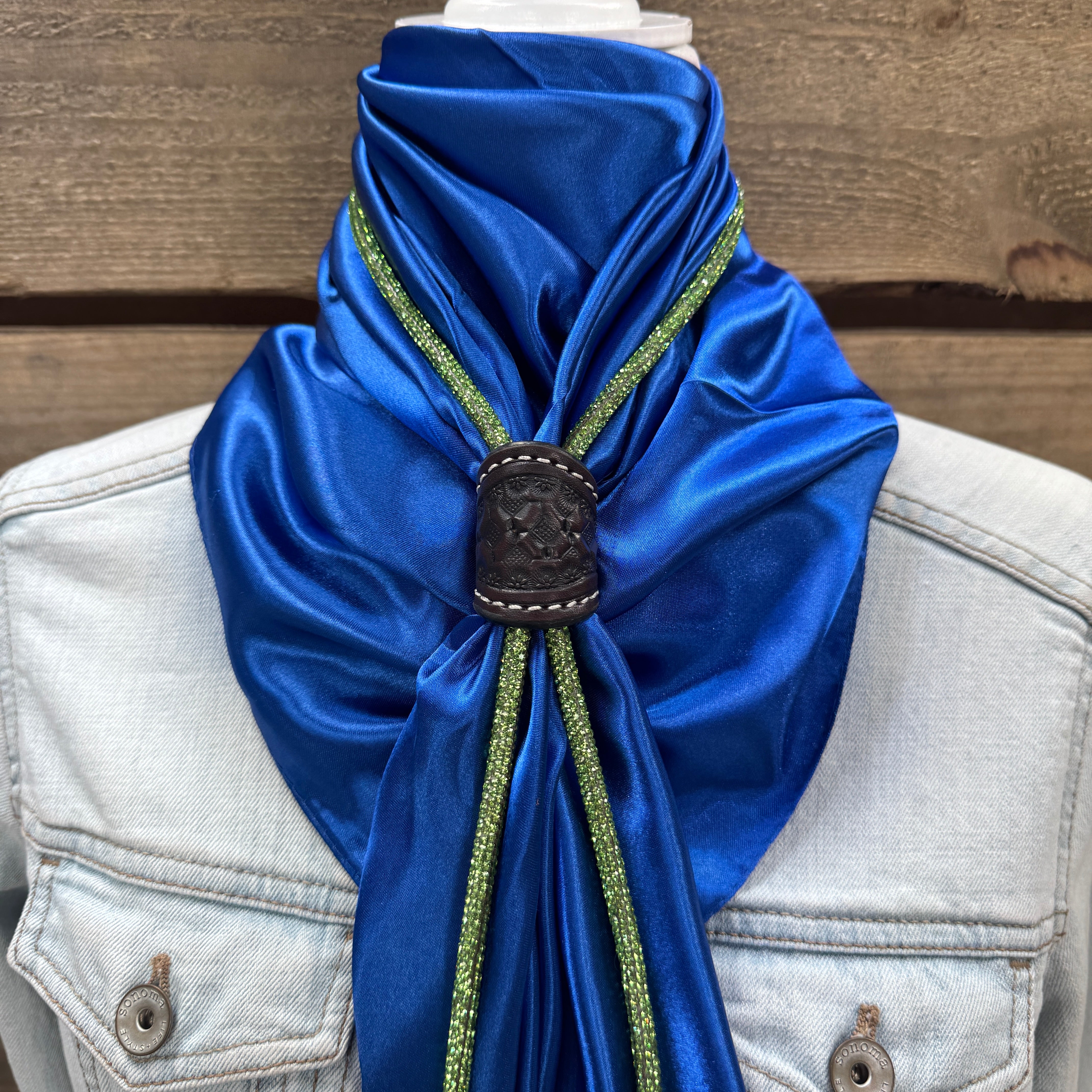 a blue scarf tied to a white jacket